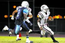 Desert Oasis running back Jocquez Kalili, racing past Canyon Springs safety Raequan Bascombe ...