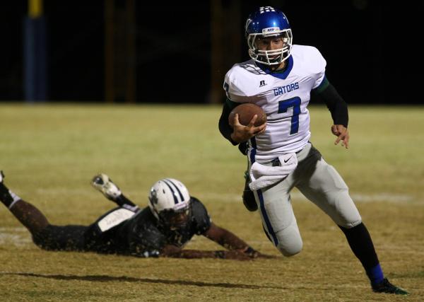 Green Valley’s Christian Lopez carries the ball on Thursday against Canyon Springs. Lo ...