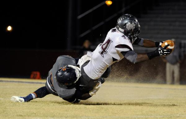 Legacy’s Erin Spaight takes down Cimarron-Memorial’s Wayne May on Friday. The Lo ...