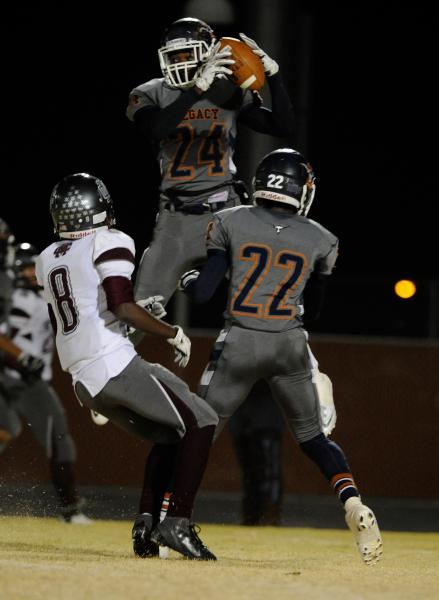 Legacy’s Casey Hughes (24) intercepts a pass on Friday against Cimarron-Memorial. The ...