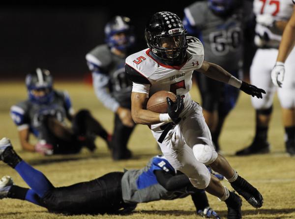 Las Vegas’ Andrew Moreland (5) gets past Basic’s Brian Evans (7) on Friday night ...