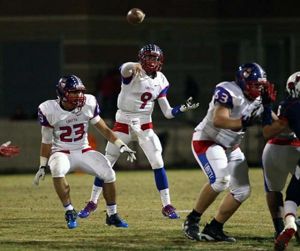 Liberty’s Tyler Newman (9) throws a pass on Friday night. Newman threw for 283 yards a ...