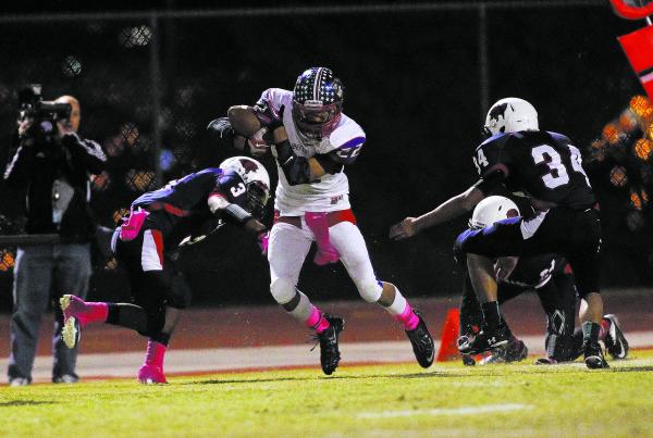 Liberty’s Deseon McQuaig (22) makes a move against Coronado defenders on Friday.