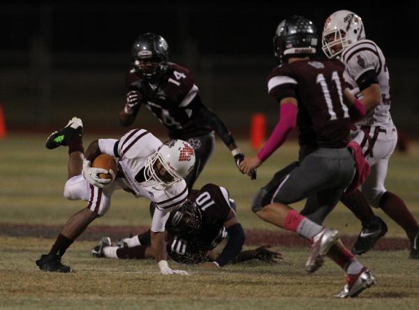 Desert Oasis running back Jocquez Kalili breaks a tackle on Friday at Cimarron-Memorial. The ...