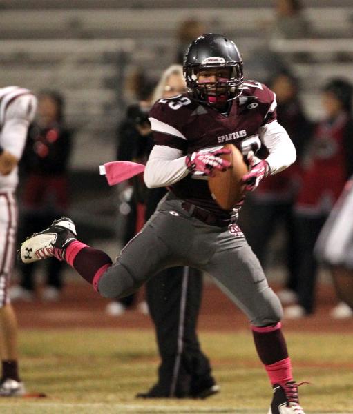 Cimarron-Memorial wide receiver Djon Watson catches a pass in the third quarter against Dese ...