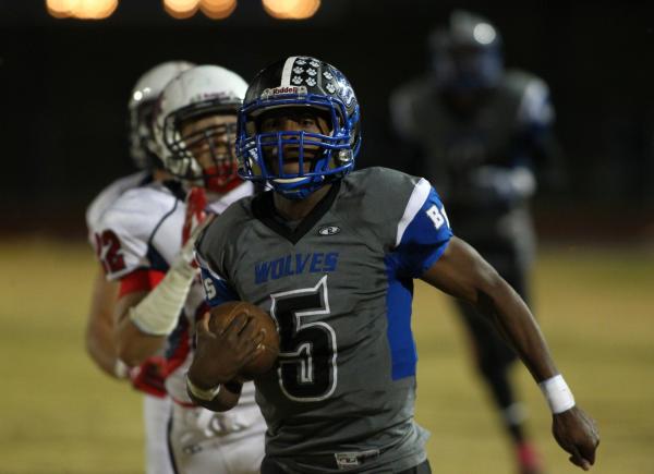 Basic’s Antraye Johnson gets past Coronado to score a touchdown on Friday. Johnson rus ...