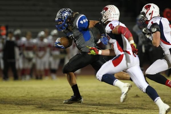 Basic’s Jon Scoffield runs the ball on Friday against Coronado. Scoffield had two TD r ...