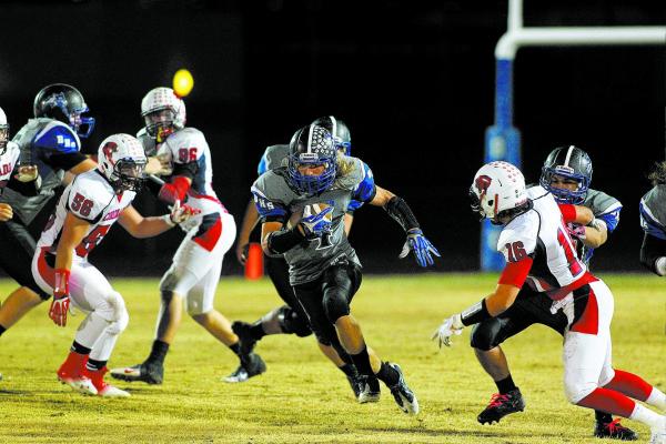 Basic’s Jon Scoffield runs the ball on Friday against Coronado. Scoffield ran for 134 ...