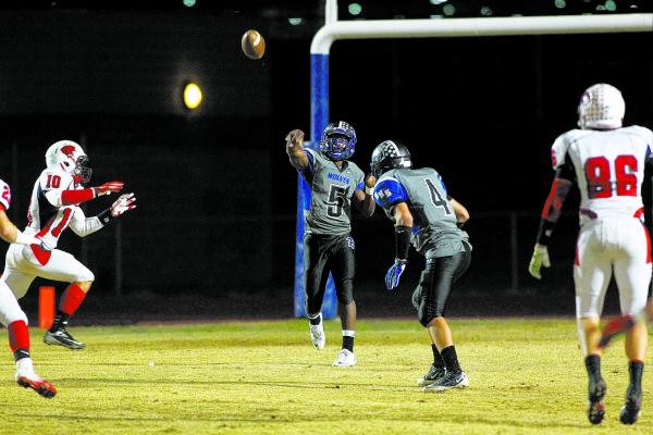 Basic’s Antraye Johnson throws a pass against Coronado.