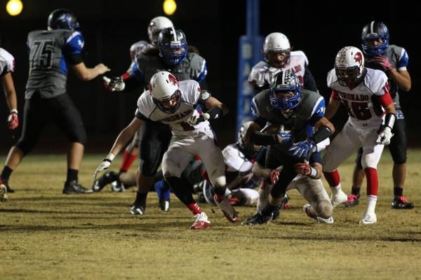 Basic’s Jon Scoffield runs the ball Friday against Coronado. Scoffield scored three TD ...