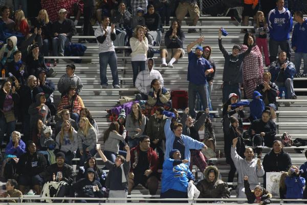 Basic fans cheer as their team leads against Coronado on Friday.