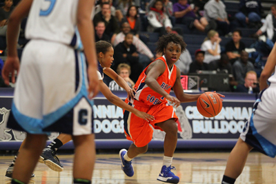 Bishop Gorman’s Tonishia Childress drives through Centennial defense during a game at ...