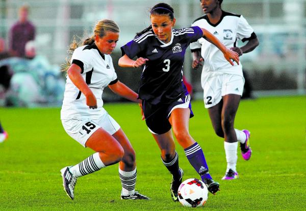 Silverado’s Krista Lee guides the ball past Foothill’s Marisa Milne during the q ...