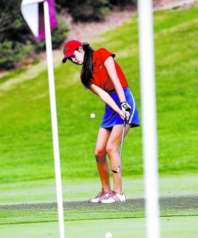 Coronado senior Olivia Greenwald chips out of the sand at a recent practice. Greenwald finis ...