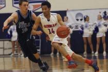 Bishop Gorman point guard Noah Robotham, right, drives past Foothill’s Vincent Modugno ...