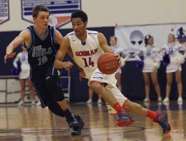 Bishop Gorman point guard Noah Robotham, right, drives past Foothill’s Vincent Modugno ...