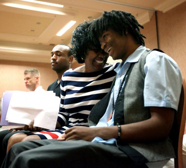 Former Green Valley linebacker LaQuan Phillips, right, gets a hug from his aunt Delphine Lak ...