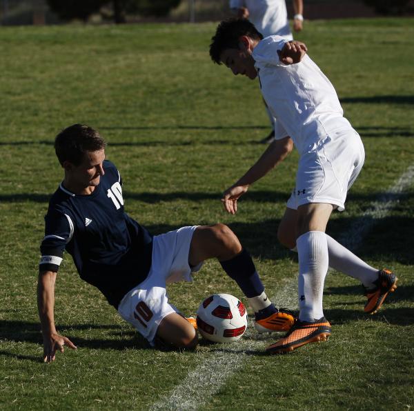 Legacy midfielder Luka Skrinjaric, left, goes for a slide tackle agains Palo Verde’s & ...