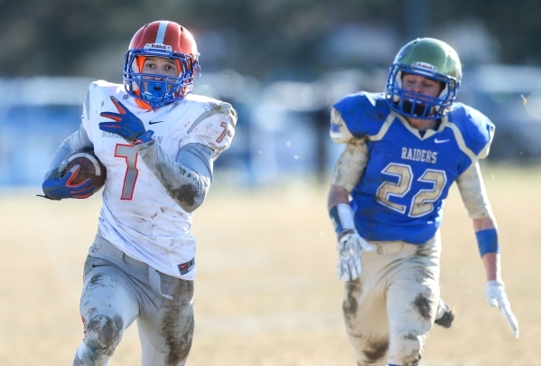 Bishop Gorman‘s Biaggio Ali Walsh (7) rushes for a touchdown against Reed defender Log ...