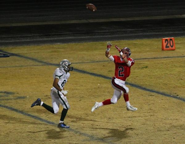 Liberty’s Drew Hladek (2) concentrates on the ball as he is being chased by Green Vall ...