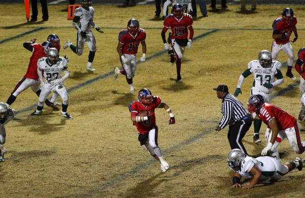 Liberty’s Spencer Wilson (8) looks for running room after intercepting a pass against ...