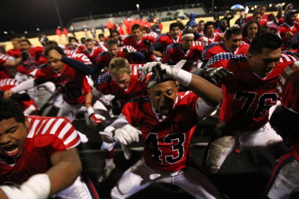 Liberty players do a celebratory haka after the game.