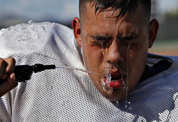 Las Vegas senior center Carlos Flores cools down durin Tuesday’s practice. Flores is o ...