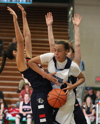 Canyon Springs’ Daijhan Cooks (24) gets an elbow into Coronado’s Katie Monaco (3 ...