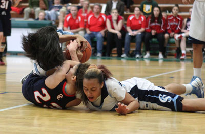 Coronado’s Sofie Cruz (23) battles for a jump ball with Canyon Springs’ Mandy Ch ...