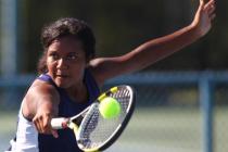 Coronado’s Paris Reese looks hits a backhand during her set with Green Valley’s ...