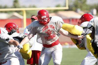 Arbor View High School football player Thomas Newton, center, is seen during practice at the ...