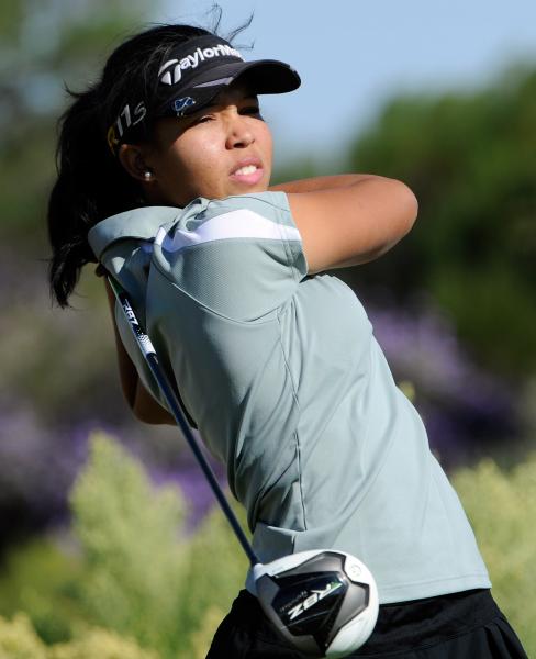 Cimarron-Memorial’s Aspen Bryant watches her tee shot during the Sunset Region girls g ...