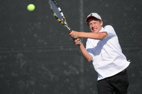 Desert Oasis’s Ben Gajardo hits a backhand against Bishop Gorman’s Dylan Leavitt ...