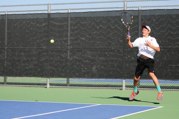 Desert Oasis’s Ben Gajardo returns a shot against Bishop Gorman’s Dylan Leavitt ...