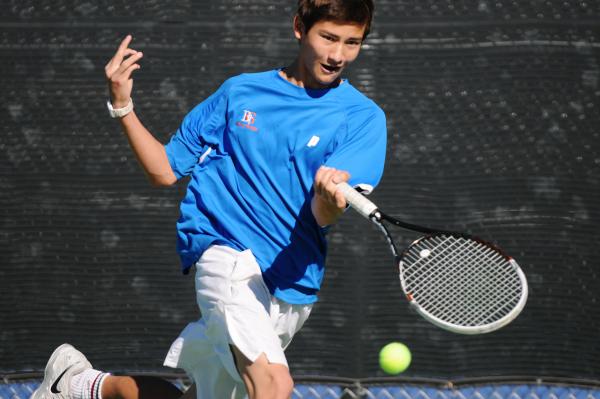 Bishop Gorman’s Dylan Leavitt returns a shot during his 6-1, 6-2 win over Desert Oasis ...