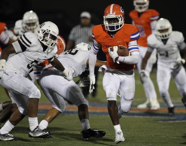 Bishop Gorman’s Daniel Stewart runs past Crespi’s Michael Mason (5) on Friday. S ...