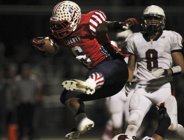 Liberty’s Niko Kapeli, seen scoring a touchdown against Coronado, is one of eight play ...