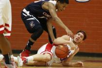 Valley’s Spencer Mathis, on ground, and Coronado’s Eddie Austin battle for the b ...