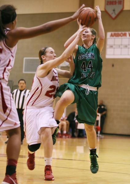 Green Valley freshman Brooke Haney (44) is fouled by Arbor View sophomore Katrina Nordstrom ...