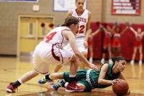 Arbor View senior Dani Chaney, left, and Green Valley senior Alexxus Johnson go after a loos ...