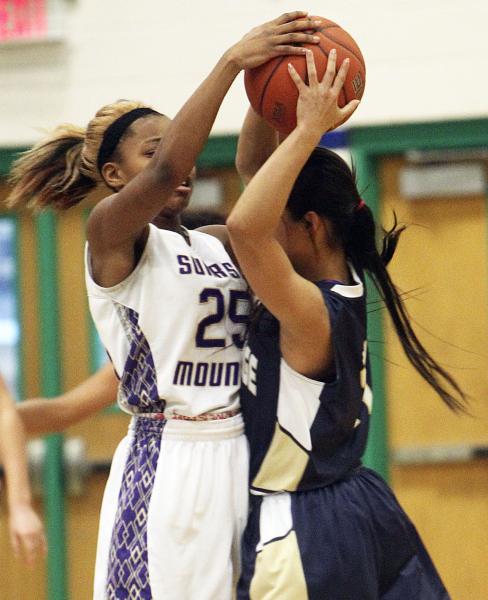 Sunrise Mountain’s Ayla Diaz (25) and Shadow Ridge’s Michelle Wager (11) battle ...