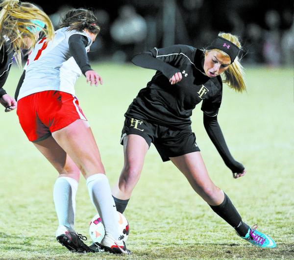 Tech’s Alex Guzman (17) fights for possession against Faith Lutheran’s Kristi Ch ...