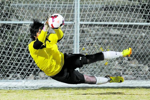 Palo Verde’s Nishesh Yadav (1) makes a save during the shootout on Thursday in the Sun ...