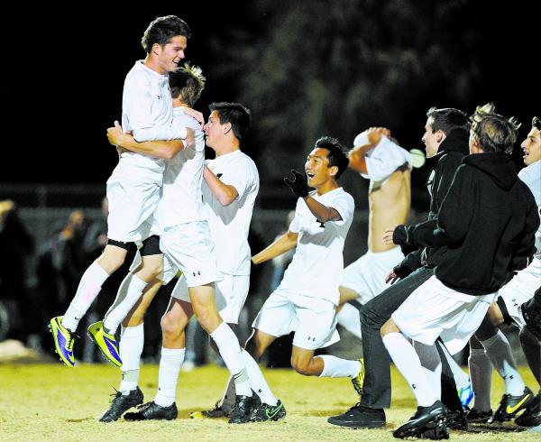 Palo Verde’s Austin Manthey (11) celebrates with his team after scoring the clinching ...