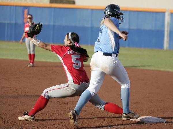 Arbor View’s Kellie Anderson, left, stretches to take a throw and force out Taylor Hun ...