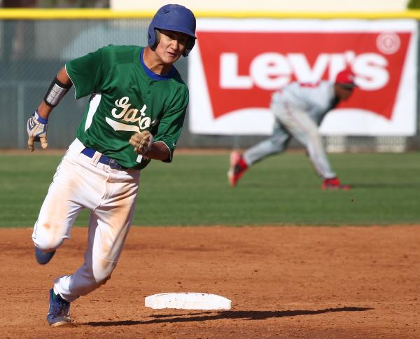 Keola Paragas runs to third base on Jarod Penniman’s fifth-inning single, Green Valley ...