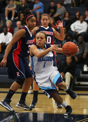 Centennial’s Tramina Jordan pushes past Liberty defense during a basketball game at Ce ...