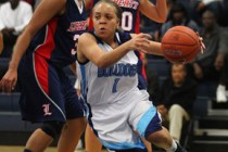 Centennial’s Tramina Jordan pushes past Liberty defense during a basketball game at Ce ...