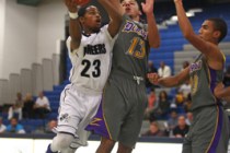 Canyon Springs’ Shaquile Carr looks to shoot over Durango’s Paris Estrada during ...