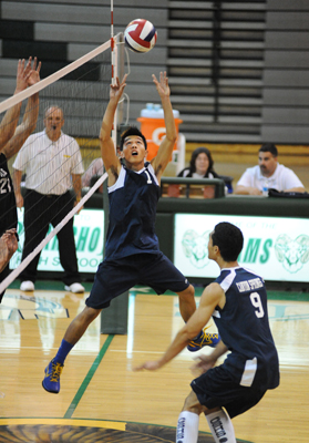 Canyon Springs high school senior varsity volleyball player, Jon Jason Duhaylungsod, sets th ...